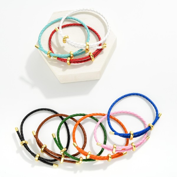 Woven Leather Adjustable Bracelet With Gold Tone Accents 

- Approximately 2.5" D