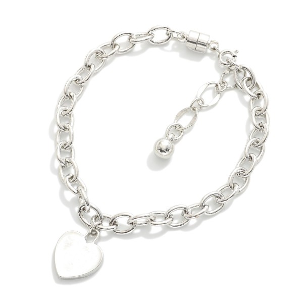 Magnetic Chain Link Bracelet Featuring Metal Tone Heart Charm 

- Gold Dipped 
- Approximately 3" D
- Extender 1" L