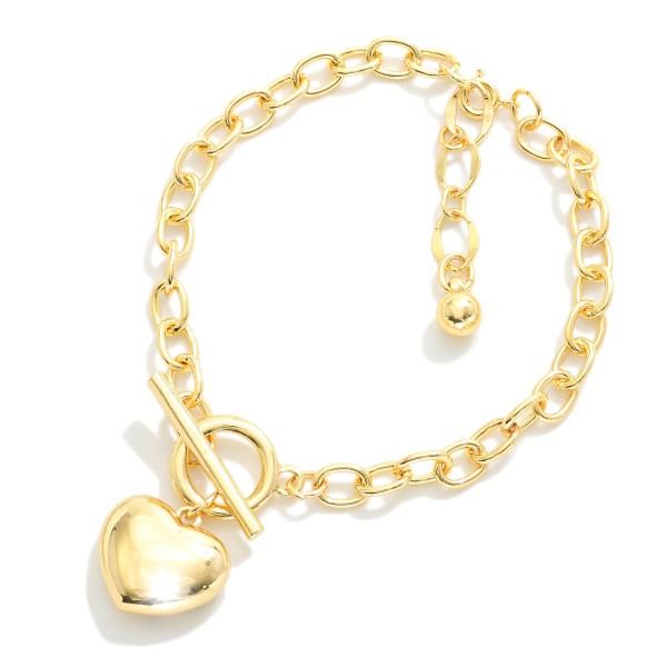 Magnetic Chain Link Bracelet Featuring Metal Tone Puffy Heart Charm

- Gold Dipped
- Approximately 2.5" D
- Extender 1" L