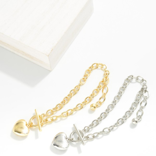 Magnetic Chain Link Bracelet Featuring Metal Tone Puffy Heart Charm

- Gold Dipped
- Approximately 2.5" D
- Extender 1" L