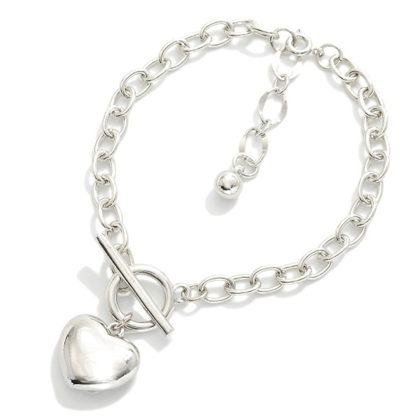 Magnetic Chain Link Bracelet Featuring Metal Tone Puffy Heart Charm

- Gold Dipped
- Approximately 2.5" D
- Extender 1" L