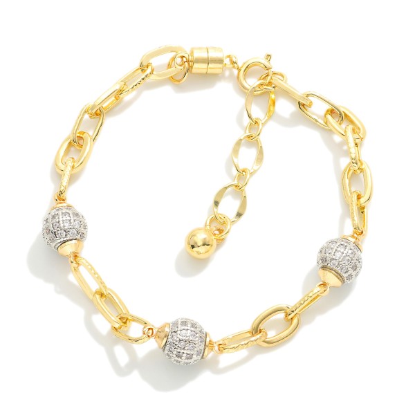 Magnetic Chain Link Bracelet Featuring Cubic Zirconia Ball Stations 

- Gold Dipped
- Approximately 3" D
- Extender 1" L