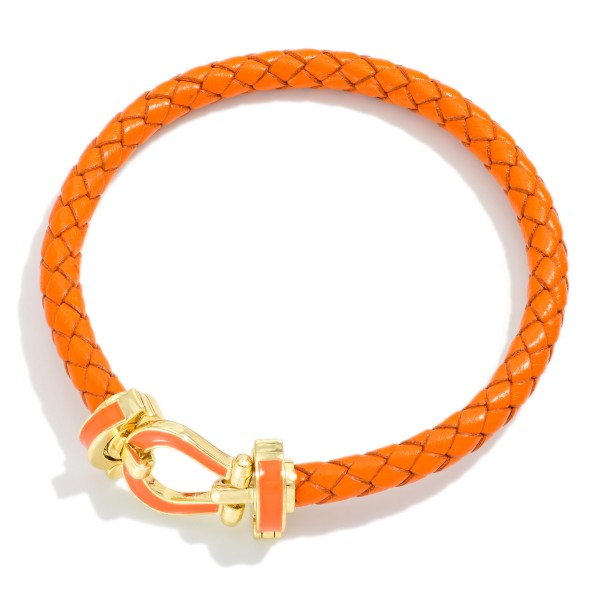 Braided Leather Bracelet Featuring Gold Tone Clasp With Enamel Accents 

-  Approximately 2.5" D
- Gold Dipped
- Hypoallergenic 
