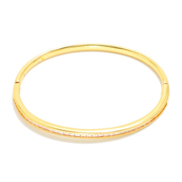 Metal Tone Bangle Bracelet Featuring Cubic Zirconia Detail  

- Approximately 2.5" D 
- Gold Dipped
- Hypoallergenic