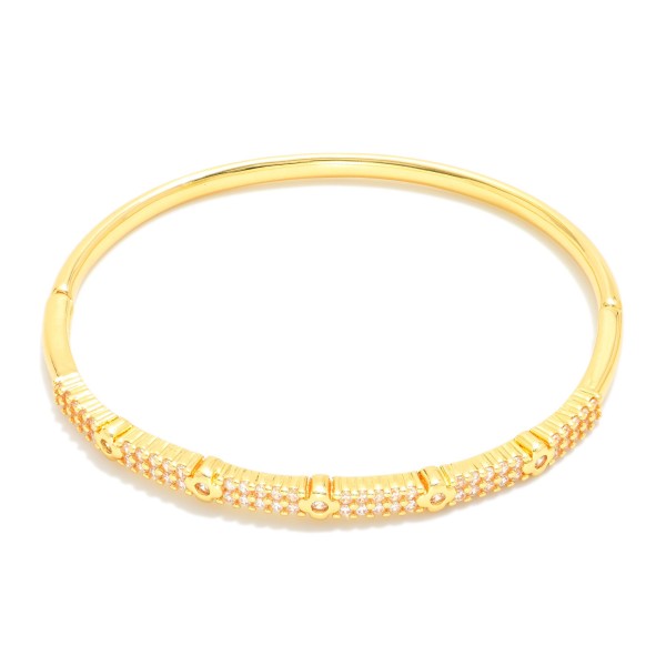 Metal Tone Bangle Bracelet Featuring Cubic Zirconia Detail  

- Approximately 2.5" D 
- Gold Dipped
- Hypoallergenic  

