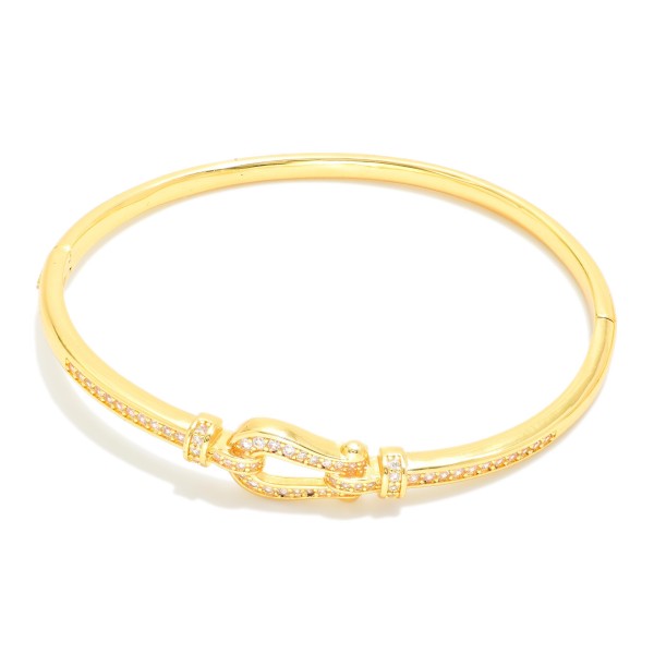 Metal Tone Clasp Bangle Bracelet Featuring Cubic Zirconia Detail  

- Approximately 2.5" D 
- Gold Dipped
- Hypoallergenic