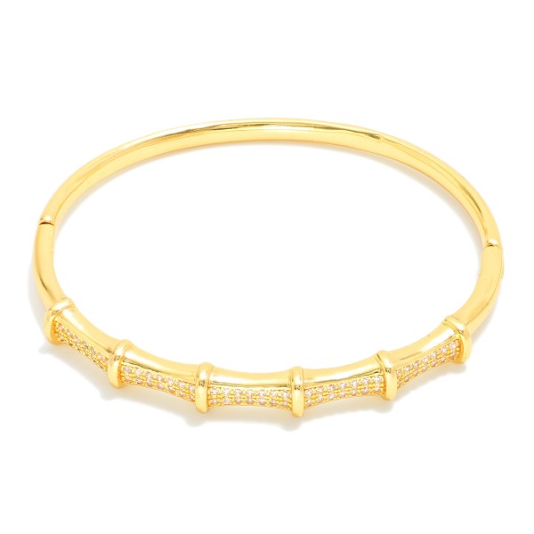 Metal Tone Bamboo Bangle Bracelet Featuring Cubic Zirconia Detail  

- Approximately 2.5" D 
- Gold Dipped
- Hypoallergenic