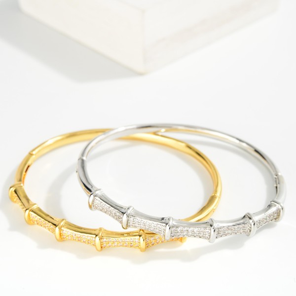 Metal Tone Bamboo Bangle Bracelet Featuring Cubic Zirconia Detail  

- Approximately 2.5" D 
- Gold Dipped
- Hypoallergenic