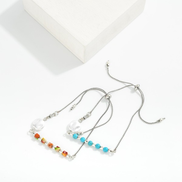 Beaded Bracelet Featuring Pearl Baroque and Bolo Slide Adjustment

- Approximately 3" D 
- Adjustable Cord