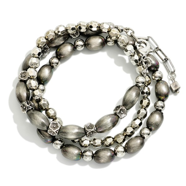 Set Of Three Metal Tone Brushed Beaded And Metal Tone Mixed Bead Stretch Bracelets 

- Approximately 2.5"  
