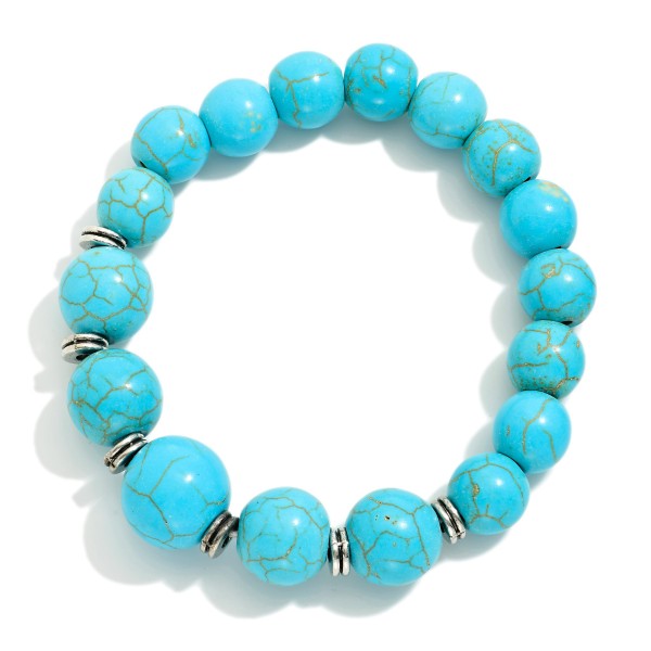 Stone Beaded Stretch Bracelet Featuring Metal Tone Disc Stations

- Approximately 2.5" D 