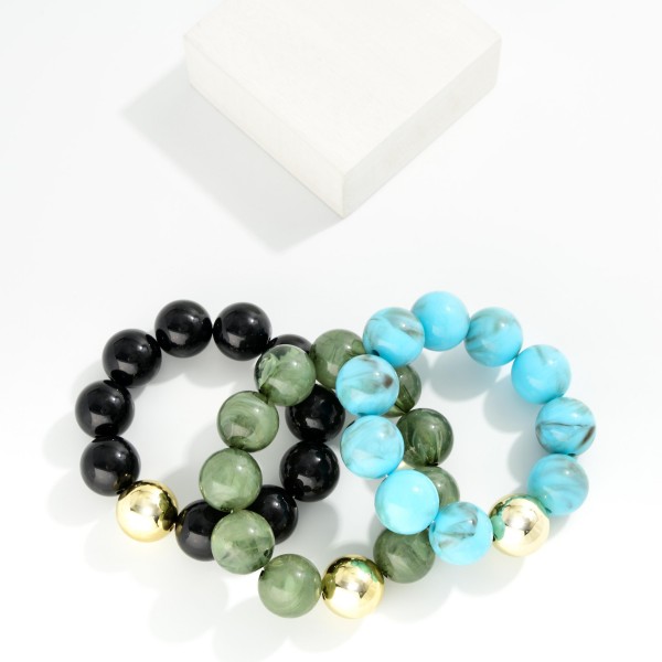 Marbled Acetate Beaded Stretch Bracelets Featuring Metal Tone 

- Approximately 3" D

