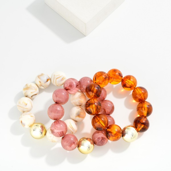 Marbled Acetate Beaded Stretch Bracelets Featuring Metal Tone 

- Approximately 3" D
