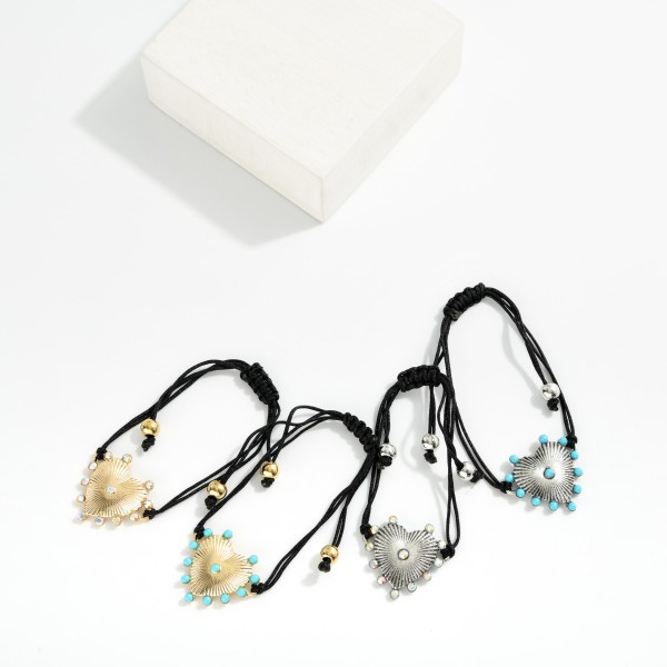 Adjustable Cord Bracelet Featuring Metal Tone Heart Charm & Rhinestone Accents 

- Approximately 3" D

