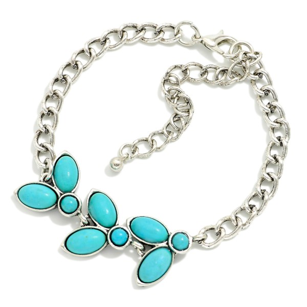 Metal Tone Chain Link Bracelet Featuring Wester Charm Turquoise Accents

- Approximately 2.5" D
- Extender 3" L 