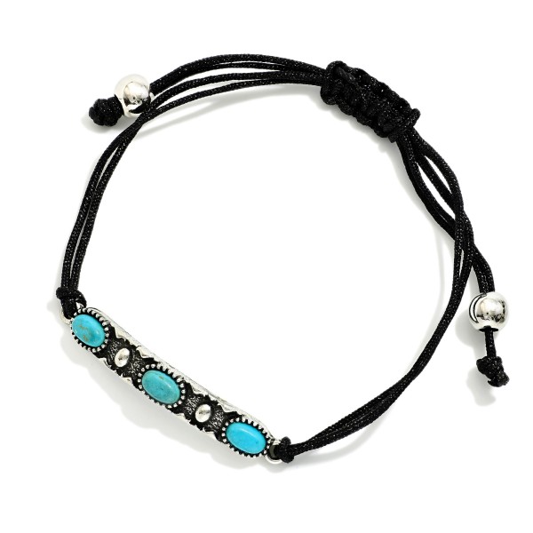 Adjustable Cord Bracelet Featuring Metal Tone Western Charm & Turquoise Accents 

- Approximately 3" D
