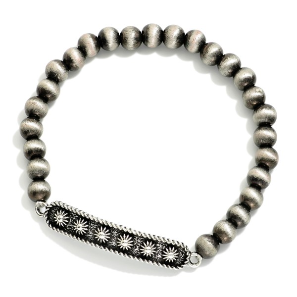Metal Tone Brushed Beaded Stretch Bracelet Featuring Metal Western Charm With Flower Engraving 

- Approximately 2.5"  