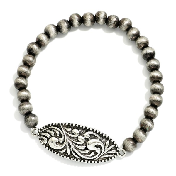 Metal Tone Brushed Beaded Stretch Bracelet Featuring Metal Western Charm With Baroque Accents

- Approximately 2.5"  