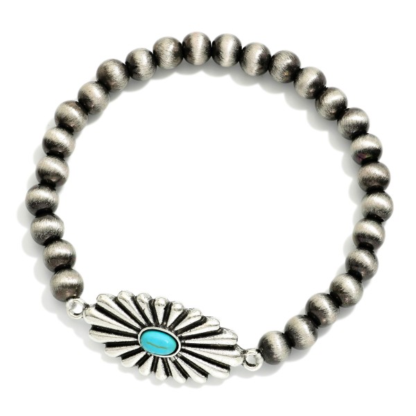 Metal Tone Brushed Beaded Stretch Bracelet Featuring Metal Western Charm With Turquoise Accents

- Approximately 2.5"  