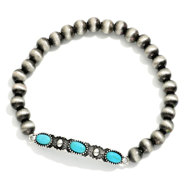 Metal Tone Brushed Beaded Stretch Bracelet Featuring Metal Western Charm With Turquoise Accents

- Approximately 2.5"  