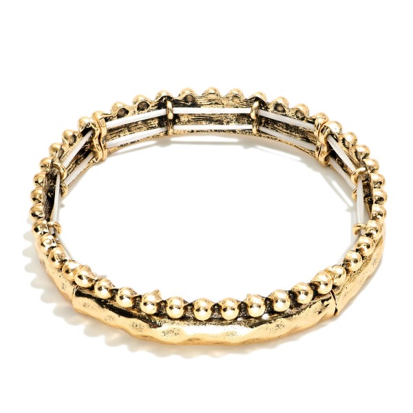 Metal Tone Hammered Bangle Stretch Bracelet Featuring Stud Ball Detail 

- Approximately 2.5" D 