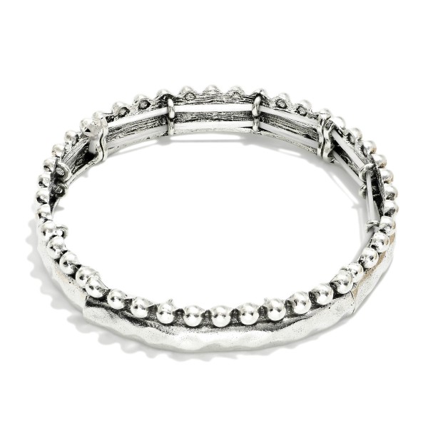 Metal Tone Hammered Bangle Stretch Bracelet Featuring Stud Ball Detail 

- Approximately 2.5" D 
