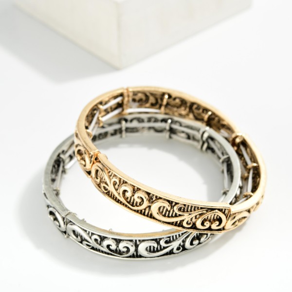 Metal Tone Bangle Stretch Bracelet Featuring Rococo Engraving 

- Approximately 2.5" D 
