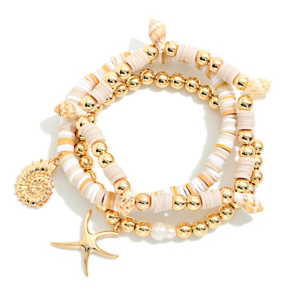 Set Of Three Heishi Beaded And Metal Ball Beaded Bracelet Featuring Shells And Gold Tones

- Approximately 3.5" D


