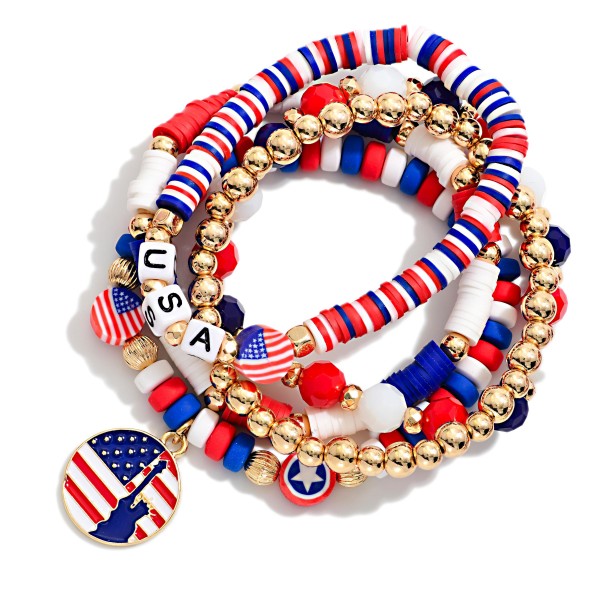 Set Of Five Americana Themed Stretch Bracelet Featuring Heishi Beads, Gold Tones, And "USA" Beaded Letters

- Approximately 3.5" D