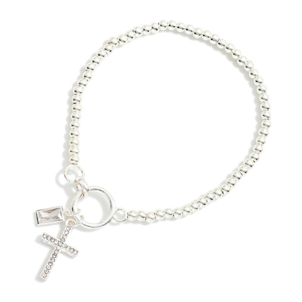 Metal Tone Beaded Stretch Bracelet Featuring Rhinestone Cross Charm 

- Approximately 2.5" D