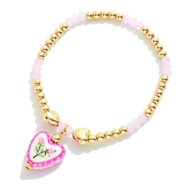 Metal Tone & Faceted Bead Beaded Stretch Bracelet With Floral Heart Charm

- Approximately 2.5" D