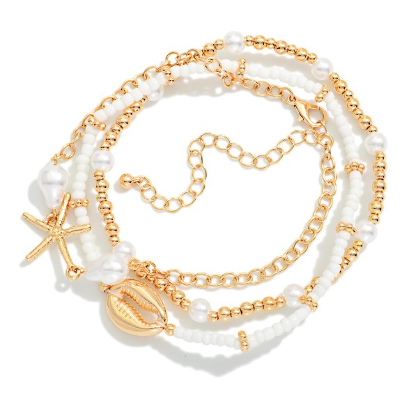 Layered Chain Link & Beaded Anklet Featuring Pearls & Metal Tone Beach Charms 

- Approximately 3.5" L
- Extender 3" L