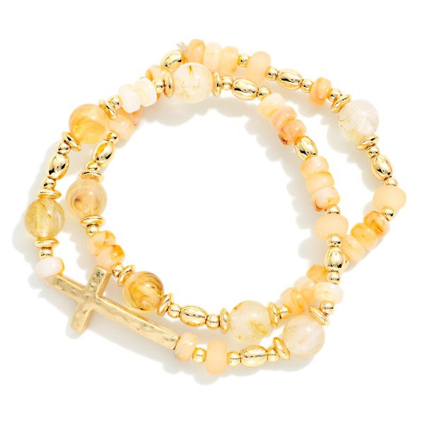 Set Of Two Beaded Bracelets Featuring Stone Disks & Metal Tone East West Cross 

- Approximately 2.5" D