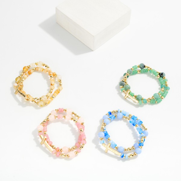 Set Of Two Beaded Bracelets Featuring Stone Disks & Metal Tone East West Cross 

- Approximately 2.5" D