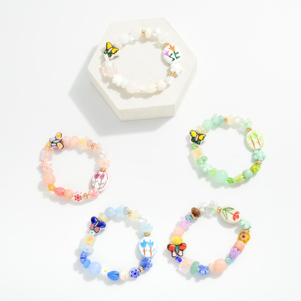 Multi Bead Beaded Stretch Bracelet Featuring Flowers & Porcelain Beads

- Approximately 2.5" D 