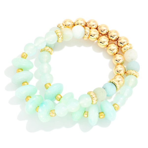 Set Of Two Beaded Stretch Bracelets Featuring Metal Tones, Marbled Disks, & Glitter Beads 

- Approximately 2.5" D