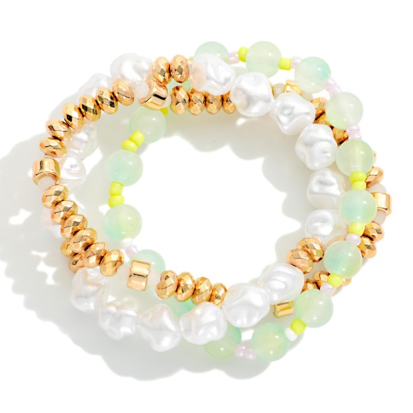 Set Of Three Beaded Stretch Bracelet Featuring Gold Tones, Pearls, And Marble Beads 

- Approximately 2.5" D 