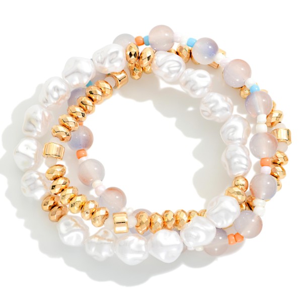 Set Of Three Beaded Stretch Bracelet Featuring Gold Tones, Pearls, And Marble Beads 

- Approximately 2.5" D 