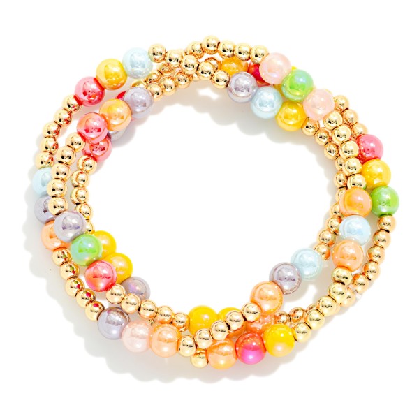 Set Of Three Iridescent & Metal Tone Bead Beaded Stretch Bracelets

- Approximately 2.5" D 