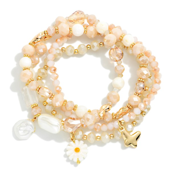 Set Of Four Beaded Stretch Bracelets Featuring Faceted Beads, Pearl, & Flower Charm 

- Approximately 3.25" D