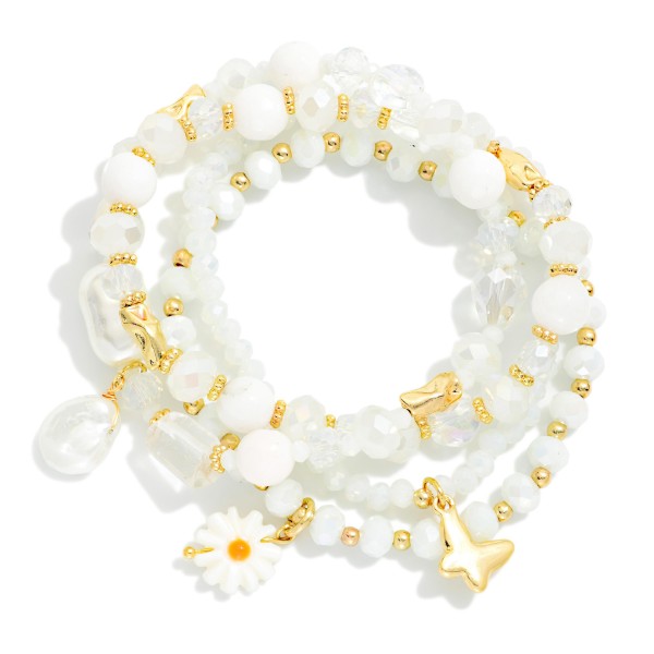Set Of Four Beaded Stretch Bracelets Featuring Faceted Beads, Pearl, & Flower Charm 

- Approximately 3.25" D