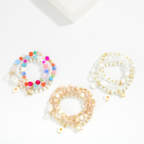 Set Of Four Beaded Stretch Bracelets Featuring Faceted Beads, Pearl, & Flower Charm 

- Approximately 3.25" D