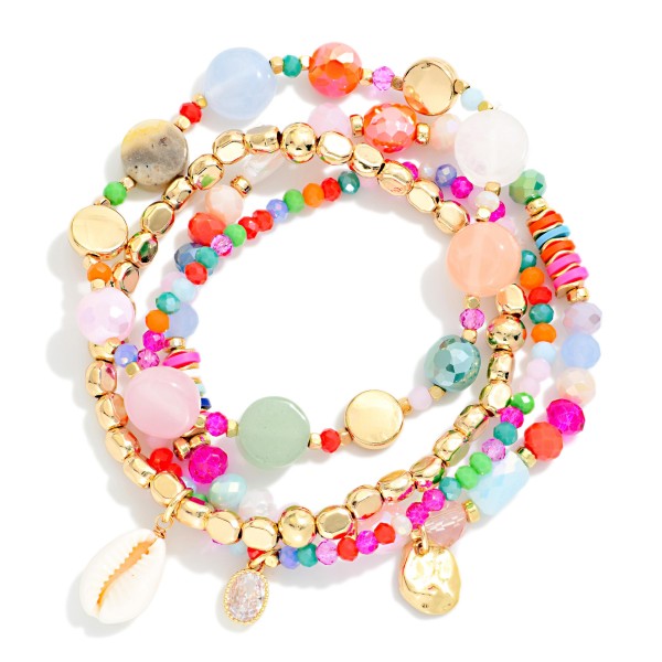 Set Of Four Multi Bead Beaded Stretch Bracelet Featuring Stone, Metal Tones, & Shell Beads 

- Approximately 3.25" D