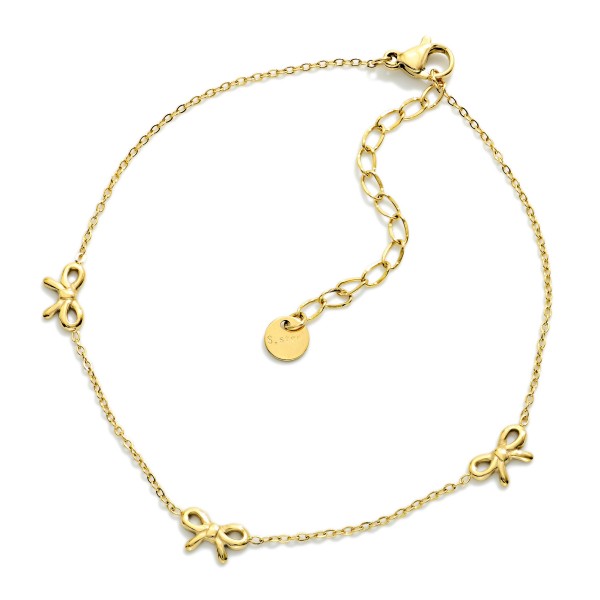 Metal Tone Chain Link Anklet Featuring Bow Stations 

- Approximately 3.05" D
- Stainless Steel
- Water & Tarnish Resistant 
- Hypoallergenic 