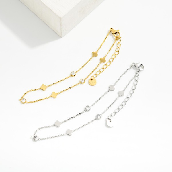 Chain Link Anklet Featuring Metal Tone Circle & Clover Charms 

- Stainless Steel
- Approximately 4" D
- Extender 1" L