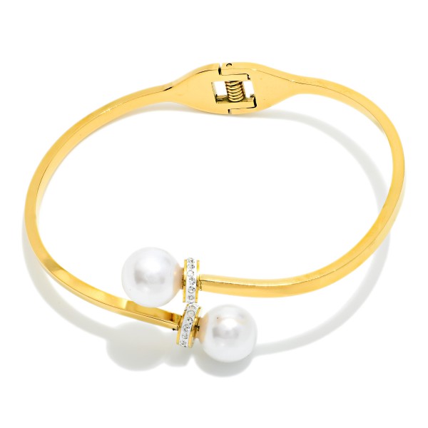 Metal Tone Hinged Cuff Bracelet With Pearl & Rhinestone Edges 

- Stainless Steel 
- Approximately 2.5" D