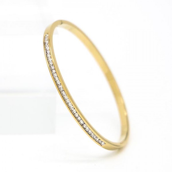 Metal Tone Hinged Bangle Bracelet With Rhinestone Details 

- Stainless Steel
- Water Resistant
- Approximately 2.5" D

