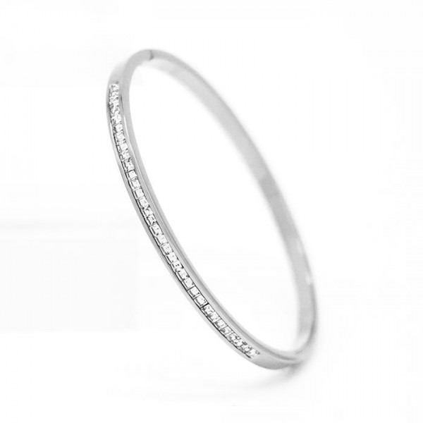 Metal Tone Hinged Bangle Bracelet With Rhinestone Details 

- Stainless Steel
- Water Resistant
- Approximately 2.5" D

