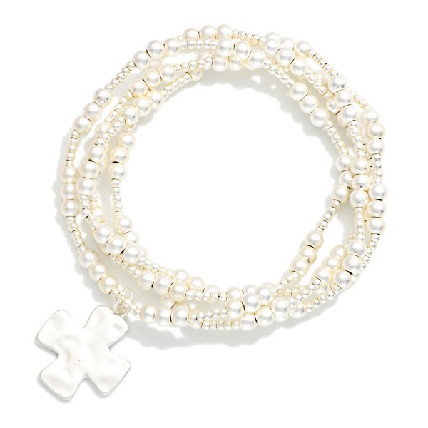 Set Of Four Metallic Beaded Stretch Bracelets Featuring Plus Cross Charm 

- Approximately 2.5" D 