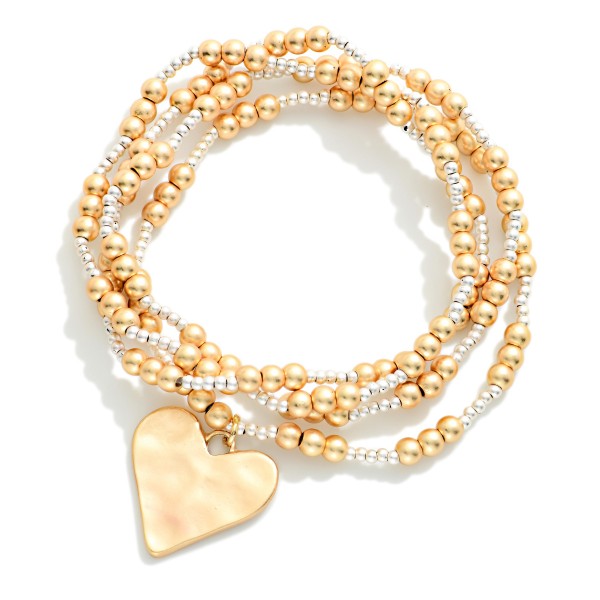 Set Of Four Metal Tone Beaded Stretch Bracelets Featuring Hammered Metal Heart Charm 

- Approximately 2.5" D